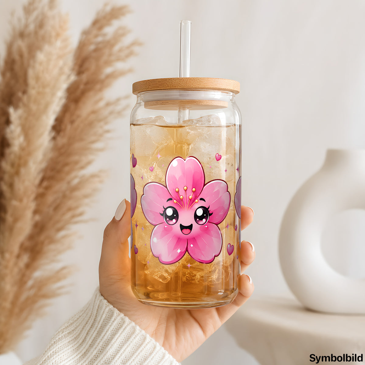Kirschblüten mit Gesicht als UV-DTF Sticker auf einem 16oz Glasbecher