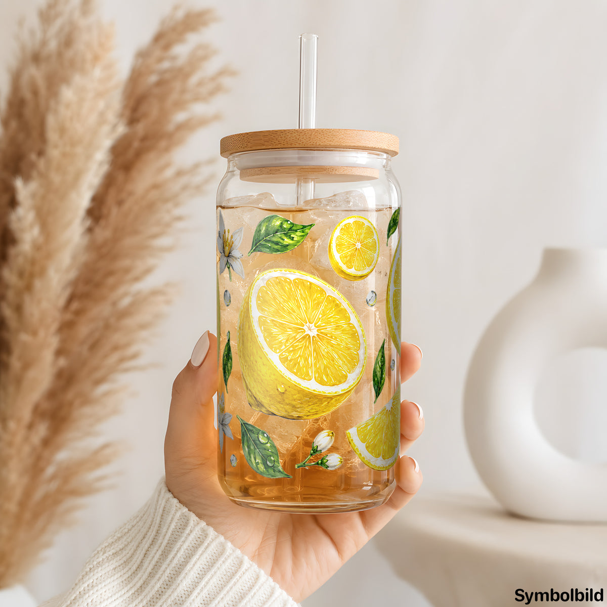Zitronen und Blüten als UV-DTF Sticker auf einem 16oz Glasbecher